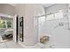 Walk-in shower with a bench and a view into the Primary bedroom at 3140 Kailani Ct, Ormond Beach, FL 32174