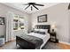 Cozy bedroom with wood floors, neutral walls, and a large window, offering a serene retreat at 3140 Kailani Ct, Ormond Beach, FL 32174