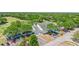 Exterior of the clubhouse surrounded by lush landscaping and mature trees, plus ample parking at 3140 Kailani Ct, Ormond Beach, FL 32174