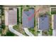Aerial view of the home showing the roof, driveway, and well-maintained landscaping at 320 Conch Key Way, Sanford, FL 32771