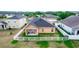A wide shot shows a well-manicured backyard with a white picket fence and mature landscaping at 320 Conch Key Way, Sanford, FL 32771