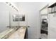 Updated bathroom with granite countertops, new fixtures, and convenient access to another room at 320 Conch Key Way, Sanford, FL 32771