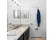Bright bathroom featuring granite countertops, a modern sink, and a full-length mirror at 320 Conch Key Way, Sanford, FL 32771