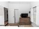 Cozy bedroom featuring a dresser, window with natural light, and warm lighting at 320 Conch Key Way, Sanford, FL 32771