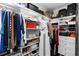 Organized walk-in closet with shelves, drawers, and hanging space for clothes and accessories at 320 Conch Key Way, Sanford, FL 32771