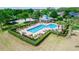Aerial view of the neighborhood pool featuring lounge chairs, a gazebo, and manicured landscaping at 320 Conch Key Way, Sanford, FL 32771