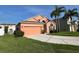 Charming exterior of a modern home with a well-manicured lawn and driveway at 320 Conch Key Way, Sanford, FL 32771