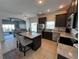 Modern kitchen featuring stainless steel appliances, granite countertops, and a convenient island with breakfast bar at 320 Conch Key Way, Sanford, FL 32771