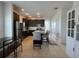Well-lit kitchen featuring stainless steel appliances, granite countertops, and a functional island with breakfast bar at 320 Conch Key Way, Sanford, FL 32771