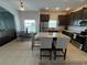 Well-lit kitchen featuring stainless steel appliances, granite countertops, and a functional island with breakfast bar at 320 Conch Key Way, Sanford, FL 32771