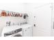 Functional laundry room with modern washer and dryer units and ample hanging space at 320 Conch Key Way, Sanford, FL 32771