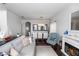 Bright living room with hardwood floors, a fireplace, comfortable seating, and dining area at 320 Conch Key Way, Sanford, FL 32771