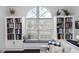 Cozy living room nook with built-in shelves, a window seat, and lots of natural light at 320 Conch Key Way, Sanford, FL 32771