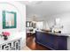 Bright living room with hardwood floors, neutral walls, fireplace, and dining area in the background at 320 Conch Key Way, Sanford, FL 32771