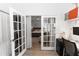 Office space with glass french doors leading to the main bedroom at 320 Conch Key Way, Sanford, FL 32771