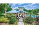 View of the pool house which offers shaded seating, washrooms and a grill for use by the community at 320 Conch Key Way, Sanford, FL 32771