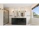 Bathroom with double vanity, shower, and decorative lighting at 3333 Atmore Ter, Ocoee, FL 34761