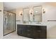 Modern bathroom with double vanity, shower, and decorative lighting at 3333 Atmore Ter, Ocoee, FL 34761