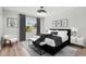 Elegantly staged bedroom features a stylish bed, modern lighting, and large windows with bright natural light at 3333 Atmore Ter, Ocoee, FL 34761