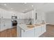 Bright, modern kitchen with white cabinets, stainless steel appliances, and a center island at 3333 Atmore Ter, Ocoee, FL 34761