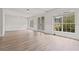 Spacious living room with beautiful french doors, windows, and light vinyl floors at 3333 Atmore Ter, Ocoee, FL 34761