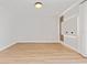 Empty living room with wood-look floors, neutral walls, and modern architectural details at 3333 Atmore Ter, Ocoee, FL 34761