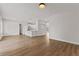 Bright and airy living room open to the kitchen, with wood-look flooring at 3333 Atmore Ter, Ocoee, FL 34761