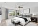 Serene primary bedroom featuring a plush bed, neutral tones, and large windows for natural light at 3333 Atmore Ter, Ocoee, FL 34761