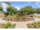 Welcome to Forestbrooke sign surrounded by lush landscaping and inviting benches at 3333 Atmore Ter, Ocoee, FL 34761