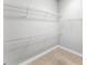Walk-in closet featuring wall-mounted metal shelves, offering ample storage solutions at 3470 Tesoro Cir, New Smyrna Beach, FL 32168