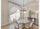 Cozy dining room featuring an elegant chandelier and neutral decor at 3470 Tesoro Cir, New Smyrna Beach, FL 32168