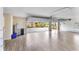 Spacious three car garage with wood look tile flooring and automatic garage door opener at 3470 Tesoro Cir, New Smyrna Beach, FL 32168