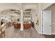 Open-concept living room featuring a coffered ceiling and wood-look tile flooring at 3470 Tesoro Cir, New Smyrna Beach, FL 32168