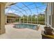 Screened-in pool offers a relaxing atmosphere to entertain or unwind at 3470 Tesoro Cir, New Smyrna Beach, FL 32168