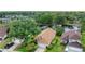 Aerial view of a single Gathering home on a landscaped lot, with a pond in the backyard at 38 Lake Walden Trl, Ormond Beach, FL 32174