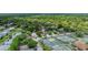 Beautiful aerial view of the community featuring a pond, tennis courts and mature trees at 38 Lake Walden Trl, Ormond Beach, FL 32174