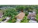 Home on a pond lot with fountain in the backyard, viewed from above at 38 Lake Walden Trl, Ormond Beach, FL 32174