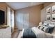 This bedroom features a modern design, wood floors, a TV, and a closet at 38 Lake Walden Trl, Ormond Beach, FL 32174