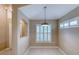 Bright dining area with shuttered windows and neutral paint at 38 Lake Walden Trl, Ormond Beach, FL 32174