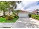Home with a spacious driveway and well-maintained landscaping at 38 Lake Walden Trl, Ormond Beach, FL 32174