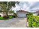 Home with a spacious driveway and well-maintained landscaping at 38 Lake Walden Trl, Ormond Beach, FL 32174