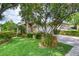 Charming home featuring a well-manicured lawn and vibrant landscaping at 38 Lake Walden Trl, Ormond Beach, FL 32174