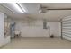 Spacious garage with epoxy flooring, utility sink, water heater and shelving at 38 Lake Walden Trl, Ormond Beach, FL 32174