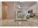 Bright kitchen featuring stainless steel appliances, granite countertops and sink with dining area at 38 Lake Walden Trl, Ormond Beach, FL 32174