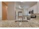Bright kitchen featuring stainless steel appliances, granite countertops and sink with dining area at 38 Lake Walden Trl, Ormond Beach, FL 32174