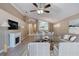 Open floor plan showcasing the living room with fireplace leading to the dining room at 38 Lake Walden Trl, Ormond Beach, FL 32174