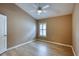 Vacant primary bedroom with neutral colors, a ceiling fan, and a window for natural light at 38 Lake Walden Trl, Ormond Beach, FL 32174