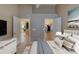 Comfortable primary bedroom featuring entrances to the kitchen and walk-in closet at 38 Lake Walden Trl, Ormond Beach, FL 32174