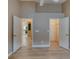 Vacant primary bedroom featuring entrances to the kitchen and walk-in closet at 38 Lake Walden Trl, Ormond Beach, FL 32174