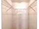 Empty walk-in closet with shelving and hanging rods for ample storage at 38 Lake Walden Trl, Ormond Beach, FL 32174